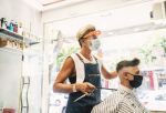 Barbershops and hair salons must practice physical distancing and use face coverings for both employees and customers.