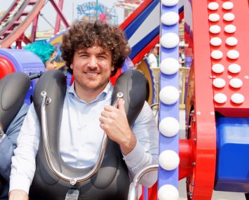 A man strapped into a rollercoaster.