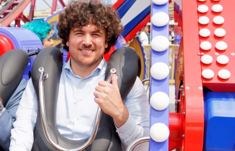 A man strapped into a rollercoaster.