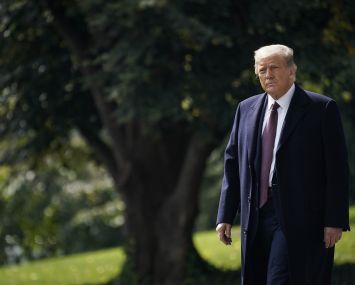 President Donald Trump walks to Marine One on the South Lawn of the White House yesterday in Washington, DC.