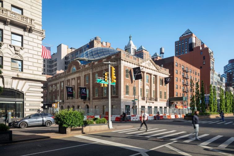 The Tammany Society originally constructed the building as its headquarters in 1927. The structure held a large auditorium and the organization's offices. A second-floor Juliet balcony that officials used to address supporters still remains. 