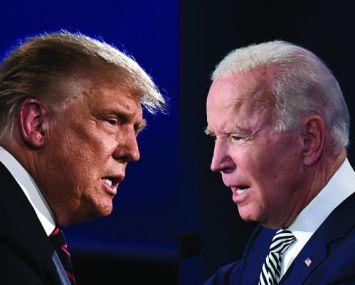 Two older men's heads staring at one another.
