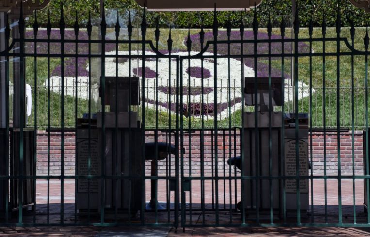 Plastic dividers surround ticket booths at the entrance to Disneyland in Anaheim.