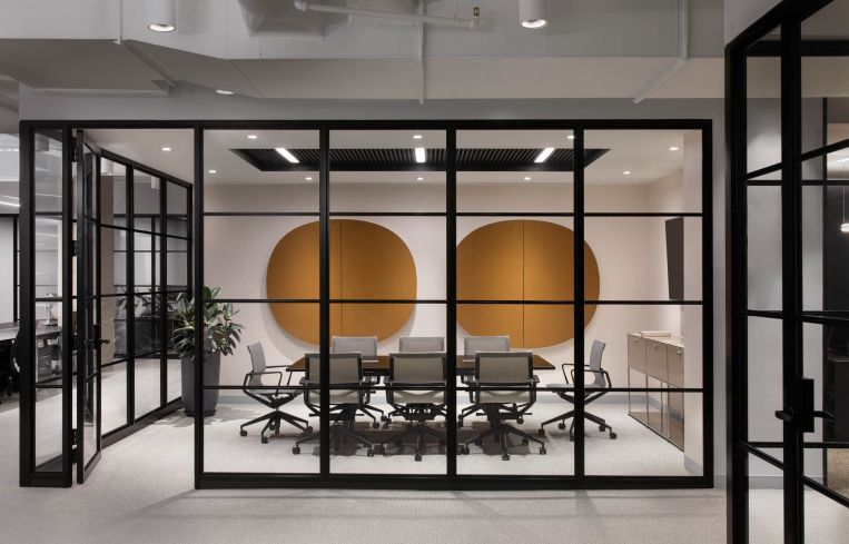 BoND used orange acuostical pads in one of the conference rooms to incorporate more color and dampne sound.