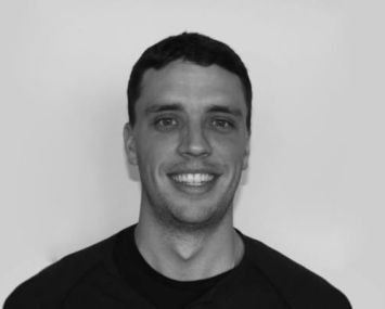 A head shot of a smiling man.