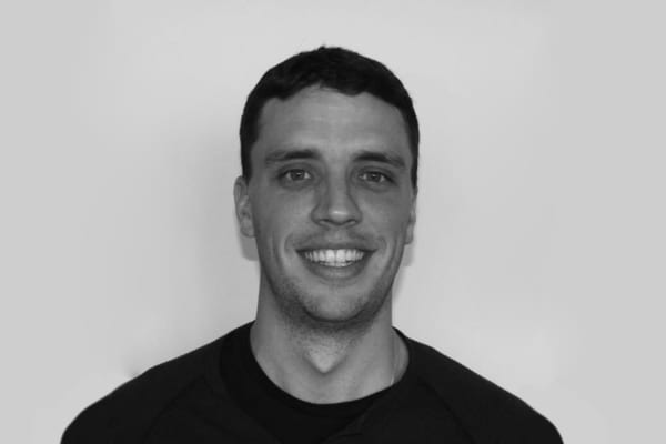 A head shot of a smiling man.