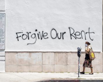 Graffiti asks for rent forgiveness on La Brea Avenue in Los Angeles. California's current moratorium lasts until until Feb. 1, 2021.