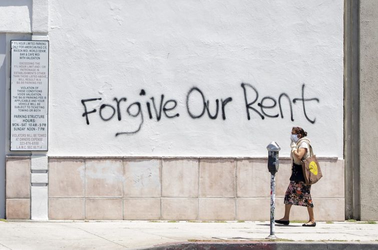 Graffiti asks for rent forgiveness on La Brea Avenue in Los Angeles. California's current moratorium lasts until until Feb. 1, 2021.
