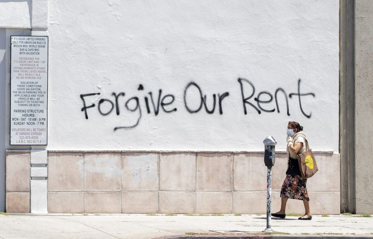 Graffiti asks for rent forgiveness on La Brea Avenue in Los Angeles. California's current moratorium lasts until until Feb. 1, 2021.