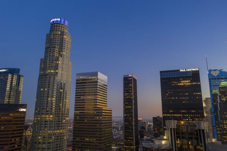 The U.S. Bank Tower, left seen in Downtown Los Angeles in May, shortly before it sold to Silverstein Properties. The tower and other high-rise office buildings have been absent more often than filled with workers since March when Gov. Gavin Newsom ordered Californians to stay home during the coronavirus (COVID-19) pandemic.