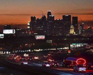 The evening rush hour commute on December 3. California Governor Gavin Newsom announced new statewide bans on gatherings and "non-essential" activities, as hospitals in the nation's most populous state face being overwhelmed by record COVID-19 cases. The limits will come into effect once 85 percent of intensive care unit beds have been filled — a development expected in four of California's five regions "as early as the next day or two."