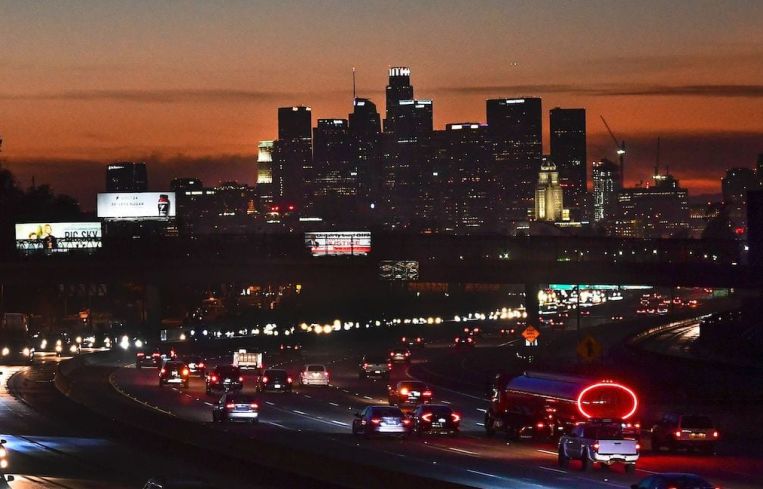 The evening rush hour commute on December 3. California Governor Gavin Newsom announced new statewide bans on gatherings and "non-essential" activities, as hospitals in the nation's most populous state face being overwhelmed by record COVID-19 cases. The limits will come into effect once 85 percent of intensive care unit beds have been filled — a development expected in four of California's five regions "as early as the next day or two."