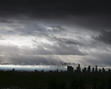 Clouds drift over the L.A. Basin as rain falls during the last storm of the year on Dec. 28.