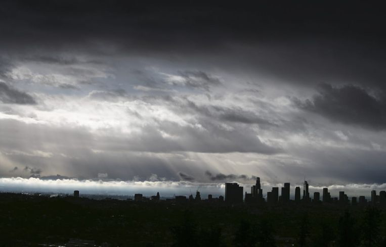 Clouds drift over the L.A. Basin as rain falls during the last storm of the year on Dec. 28.