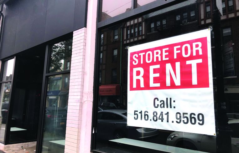 Store for Rent sign, due to Coronavirus Pandemic shutdown and loss of business, Queens, New York