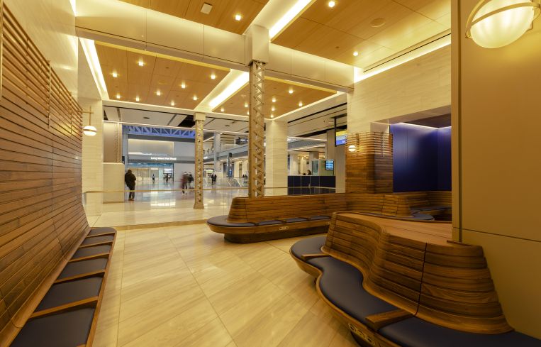 The lounge for ticketed passengers was designed by Rockwell Group and features photographic recreations of historic events at the original Penn Station by artist Stan Douglas.