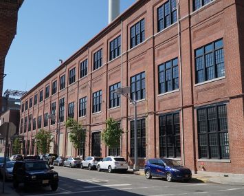 Building 127, a former shipbuilding warehouse at the Brooklyn Navy Yard, has attracted two new industrial design tenants.