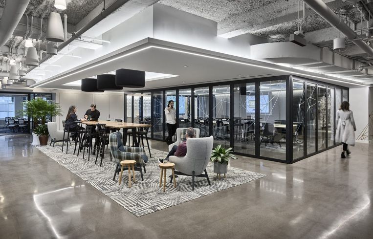 An open meeting space and a conference room.