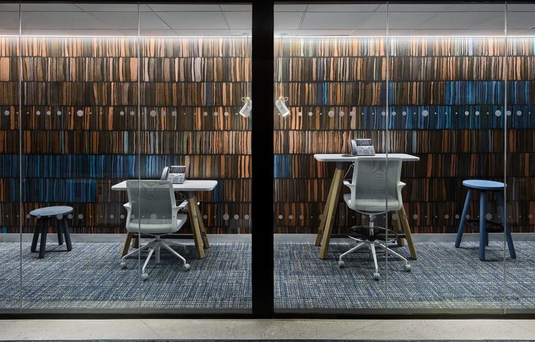 Conference rooms and small meeting rooms have colorful feature walls.
