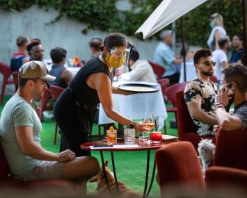People have drinks and dine on the outdoor patio at La Boheme in West Hollywood. With the stay-at-home order lifted, restaurants to restart outdoor dining.