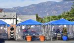 Tents for outdoor dining are seen in a restaurant's parking lot in November. Restaurants, wineries and breweries remain open for pick-up, delivery and take-out only until Jan. 29, at which point they will be allowed to reopen with restrictions.