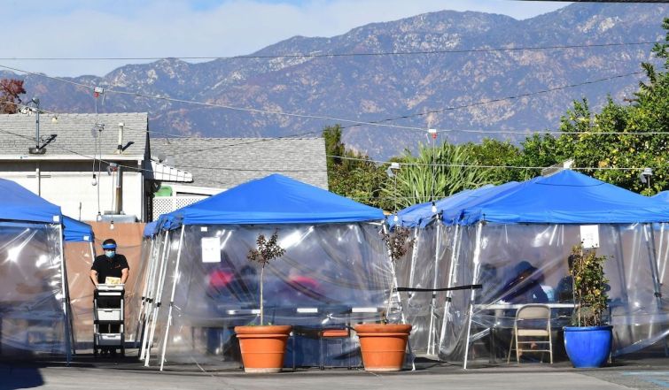 Tents for outdoor dining are seen in a restaurant's parking lot in November. Restaurants, wineries and breweries remain open for pick-up, delivery and take-out only until Jan. 29, at which point they will be allowed to reopen with restrictions.