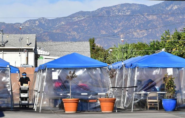 Tents for outdoor dining are seen in a restaurant's parking lot in November. Restaurants, wineries and breweries remain open for pick-up, delivery and take-out only until Jan. 29, at which point they will be allowed to reopen with restrictions.