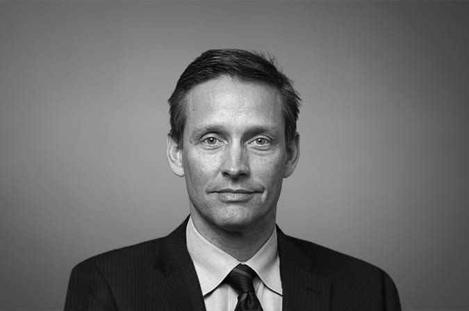 A man smiling into the camera.