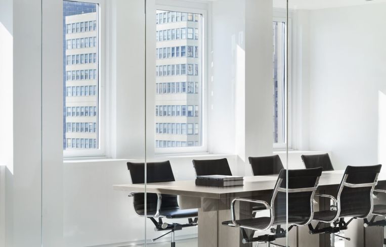 A conference room was encased in rounded glass to let in as much light as possible.