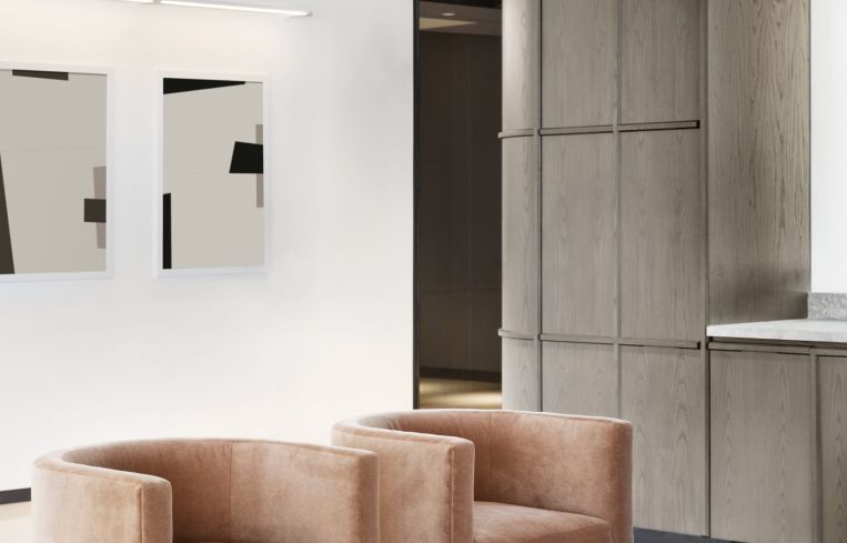 The curved wooden walls and rounded seating evoke a midcentury vibe.