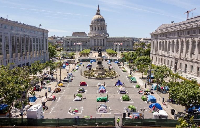 Squares painted on the ground to encourage homeless people to keep to social distancing at a city-sanctioned homeless encampment across from City Hall in San Francisco in 2020, amid the novel coronavirus pandemic.