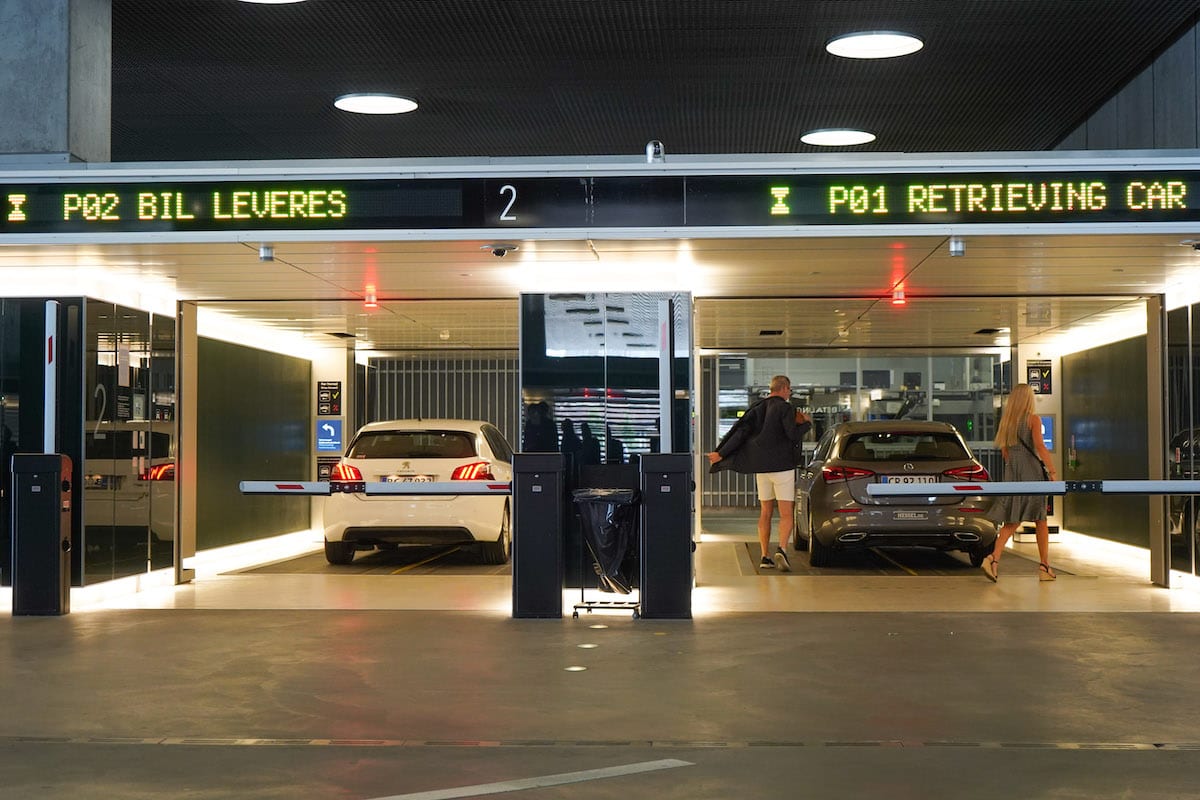 A couple accepts their car in an automated car park. 
