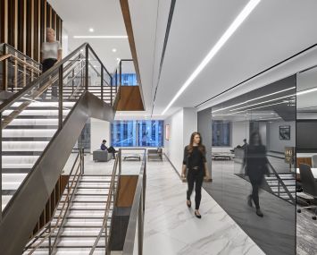 Ted Moudis Associates designed the 411,000-square-foot office for Japanese bank Mizuho at 1271 Avenue of the Americas.