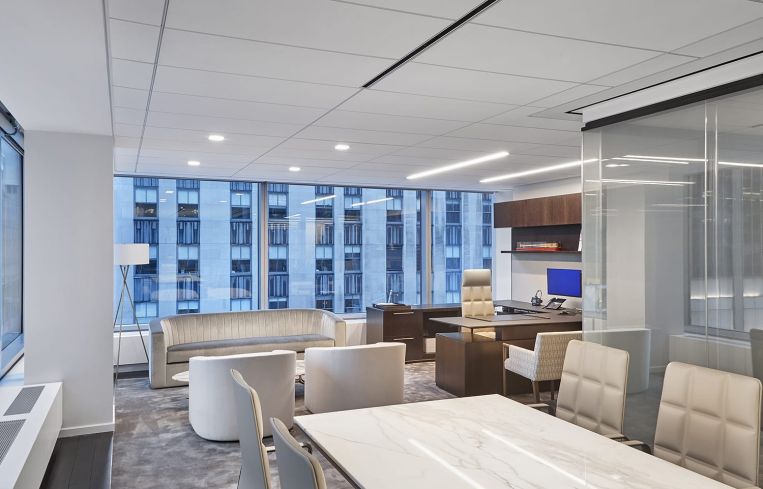 A conference room that features more casual midcentury-style seating.