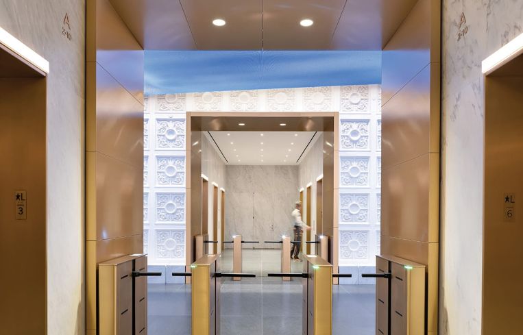 The updates, which include new brass entry portals and marble walls in the elevator lobby.