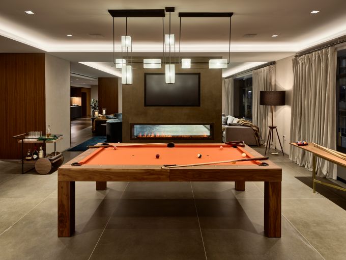 The game room with a pool table just beyond the wall. 