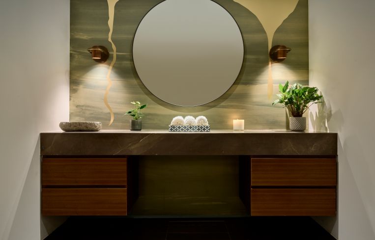 An upscale bathroom with showers offers a respite for people who work out in the amenity center or who bike or run to work in the building.