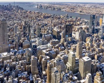 Aerial shot of a large city with many buildings.
