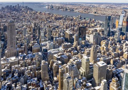 Aerial shot of a large city with many buildings.