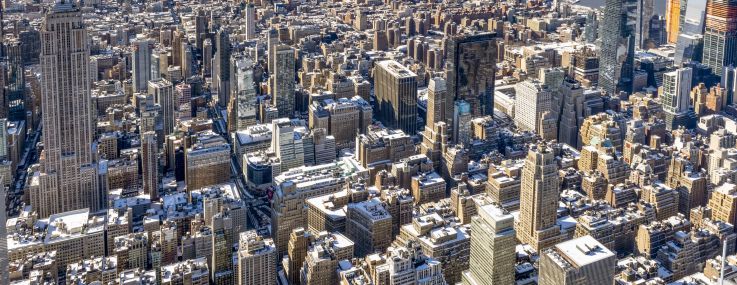 Aerial shot of a large city with many buildings.