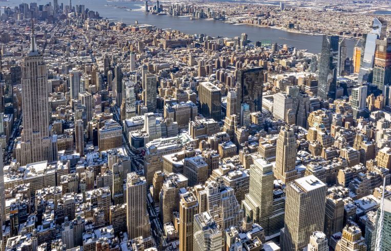 Aerial shot of a large city with many buildings.