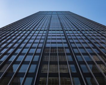 Looking up at a very tall tower.