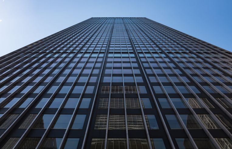Looking up at a very tall tower.