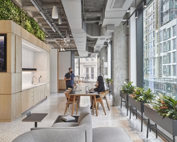 Perkins & Will's new office at 1250 Broadway includes two pantries, one of which has a plant wall on top of it.
