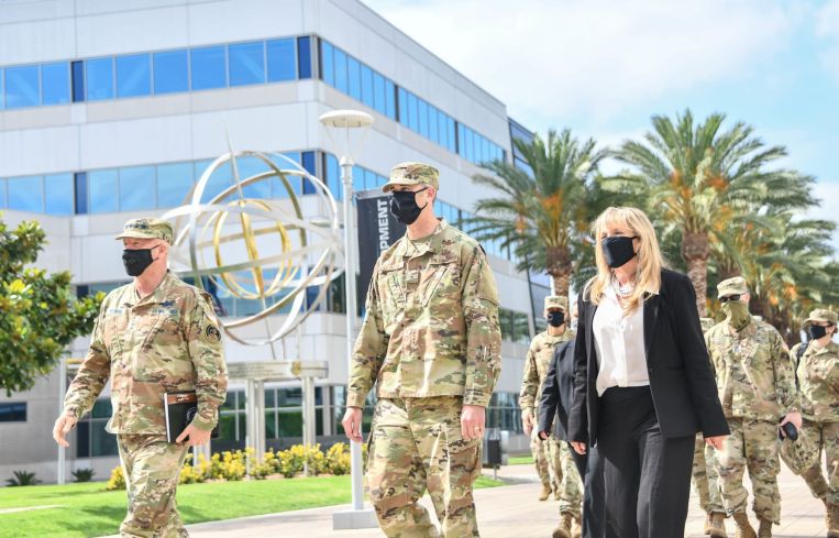 Gen. Jay Raymond (left), U.S. Space Force Chief of Space Operations and commander of U.S. Space Command, are welcomed by Brig. Gen. D. Jason Cothern (center), Space and Missile Systems Center vice commander, and Joy White (right), SMC executive director at Los Angeles Air Force Base.
