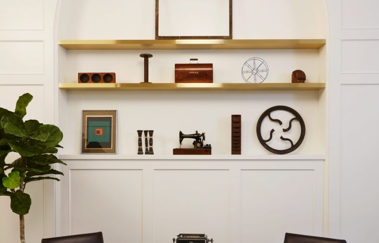 Outpost Architecture decorated the shelves with historic sewing machines and other historic garment-making items in a nod to the building's history as a garment factory.