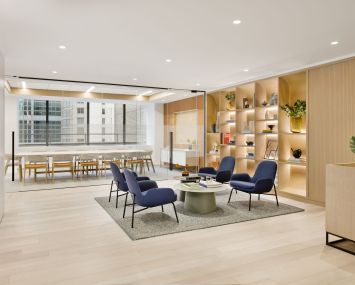 Two new prebuilt office suites at 685 Third Avenue incorporate custom designed white oak shelving, wall paneling and finishes for a midcentury modern vibe.