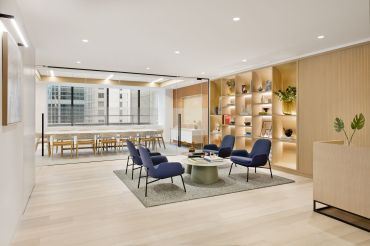 Two new prebuilt office suites at 685 Third Avenue incorporate custom designed white oak shelving, wall paneling and finishes for a midcentury modern vibe. 