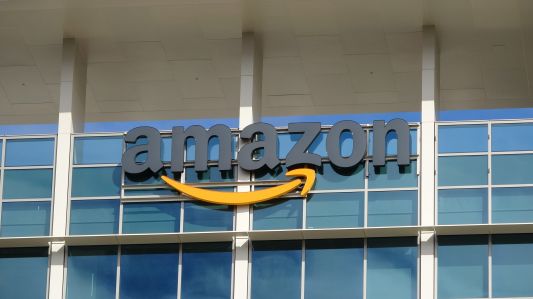 A sign outside a building that says Amazon.