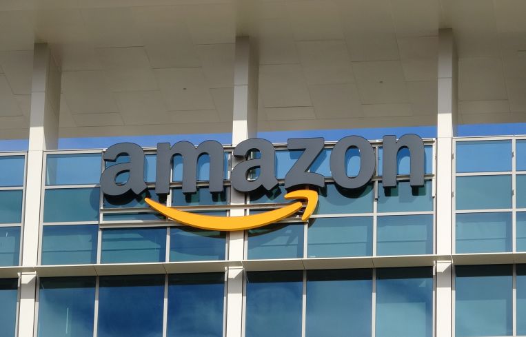 A sign outside a building that says Amazon.